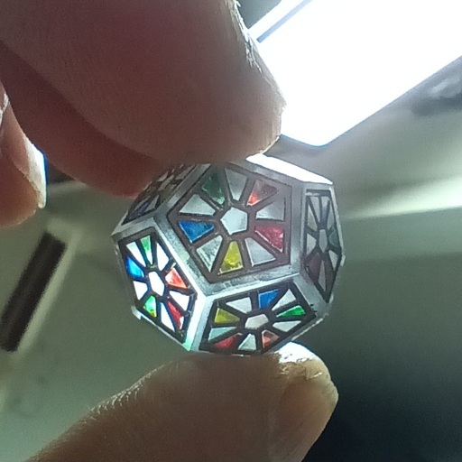 d12 clear insert with "stained glass" pattern and colors.